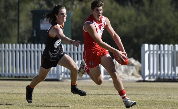 20170913_rayner_hero.jpg QBE Sydney Swans Academy member Josh Rayner runs away from his Giants opponent. - Sydney Swans